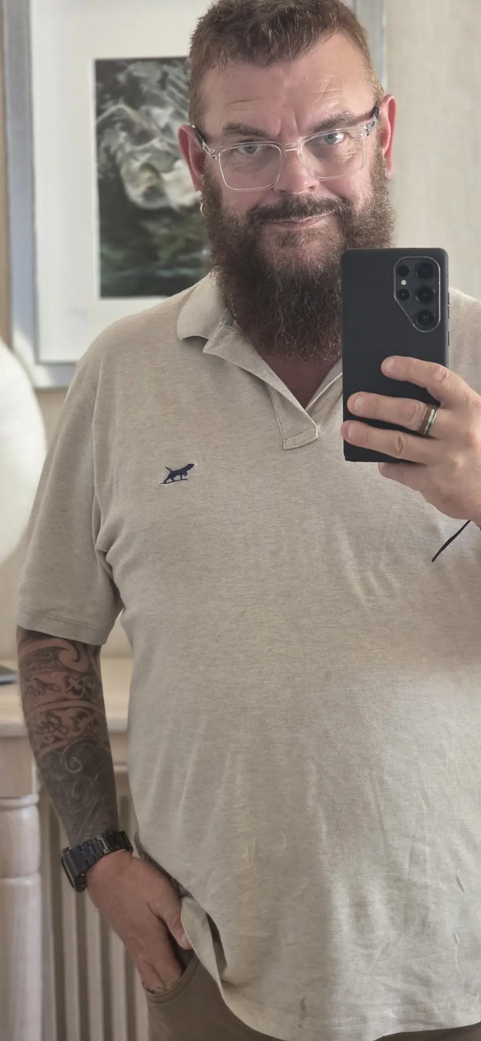 Paul Willard wearing a light polo shirt and glasses